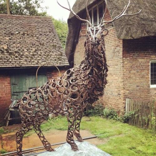 large stag sculpture looking at camera