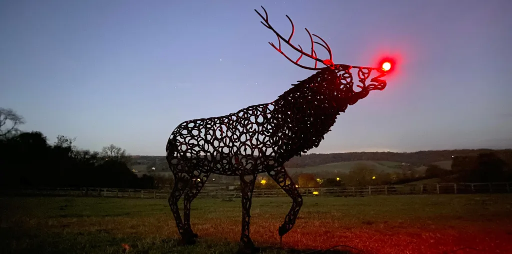 Image of a deer sculpture with red nose