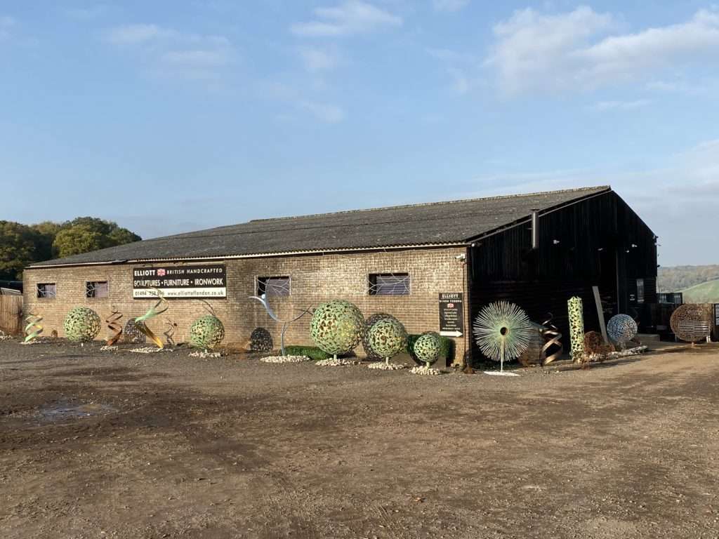 Warehouse With Sculptures Outside