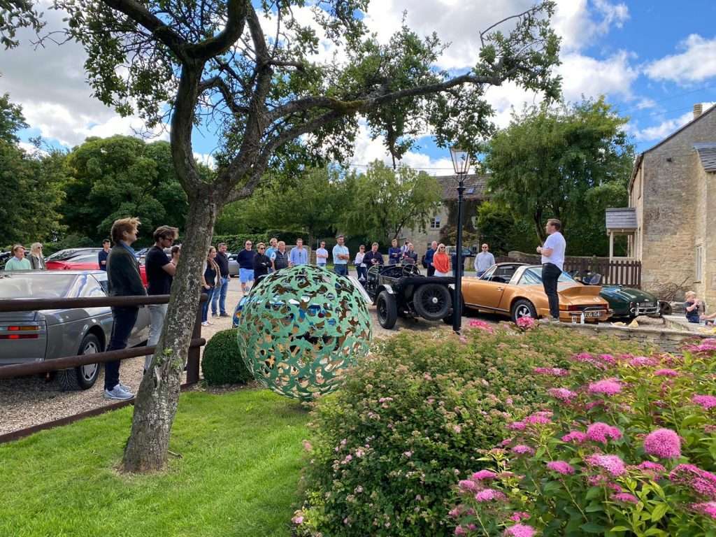 people gathered around a man talking