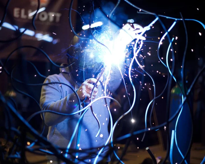 Person Using A Blowtorch On Metal