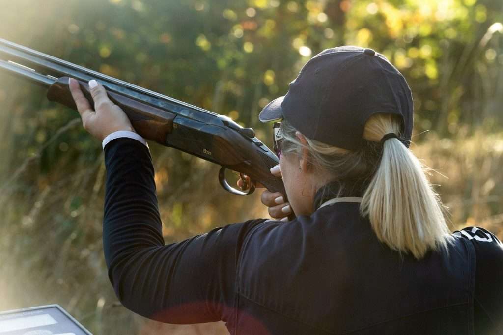 Women holding a shotgun