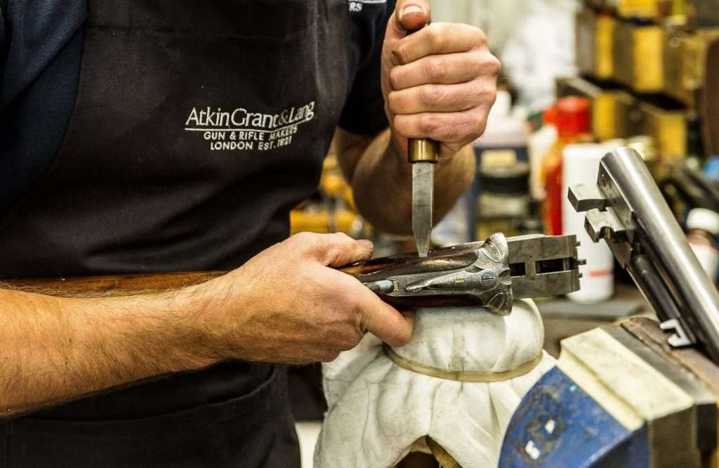Man repairing a gun