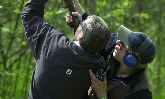 Image of two people shooting