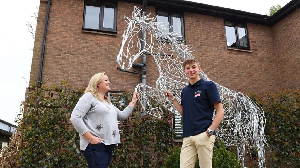 Standing Horse With Two People Next To It