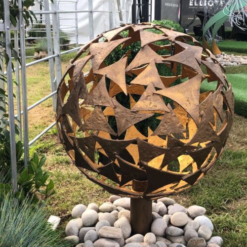 small bronze sphere in garden