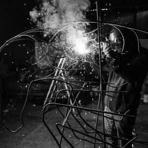 Image of Elliott welding a sculpture