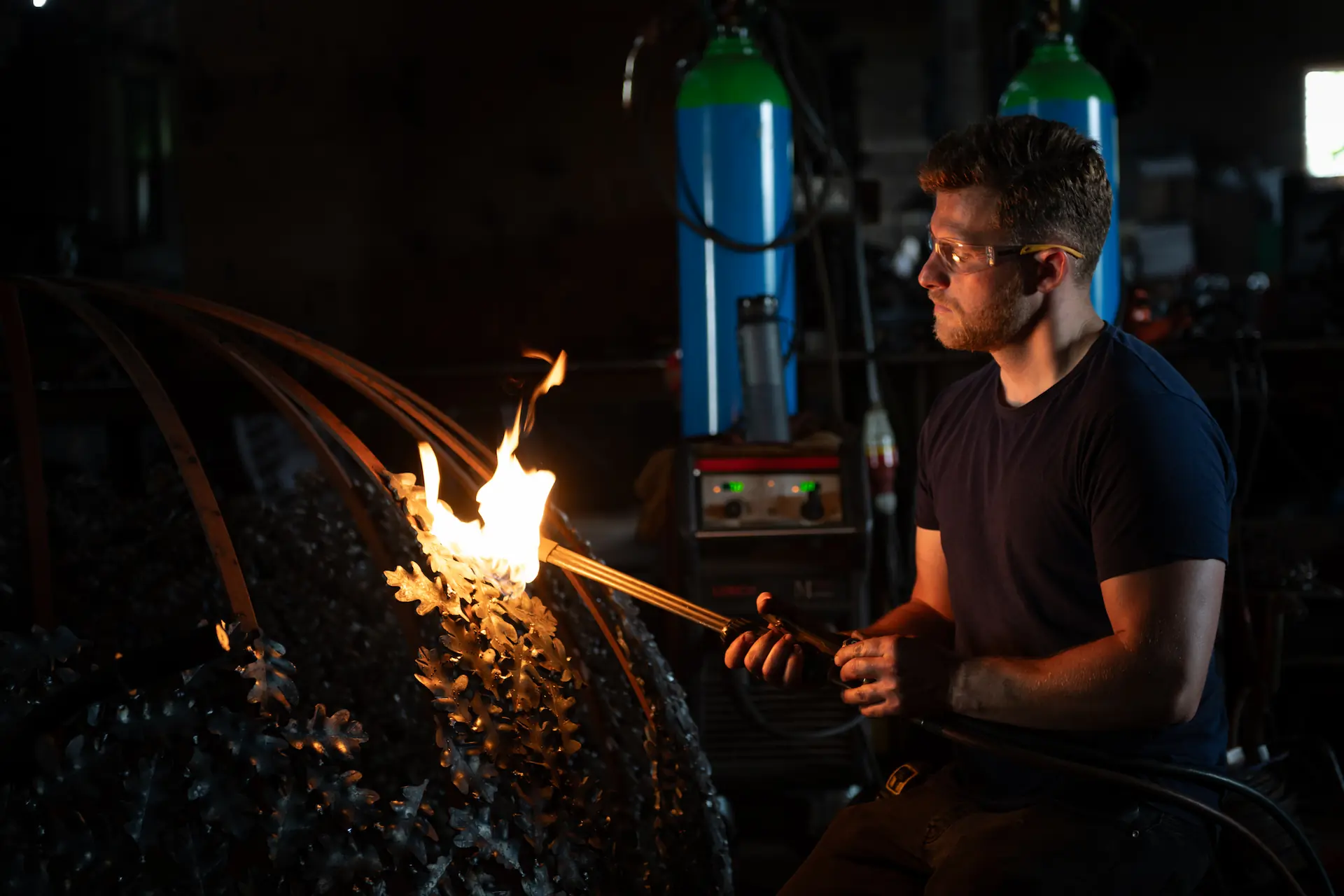 Charles Elliott making a bronze and steel sculpture by hand in his studio at Wolds Farm, Tring