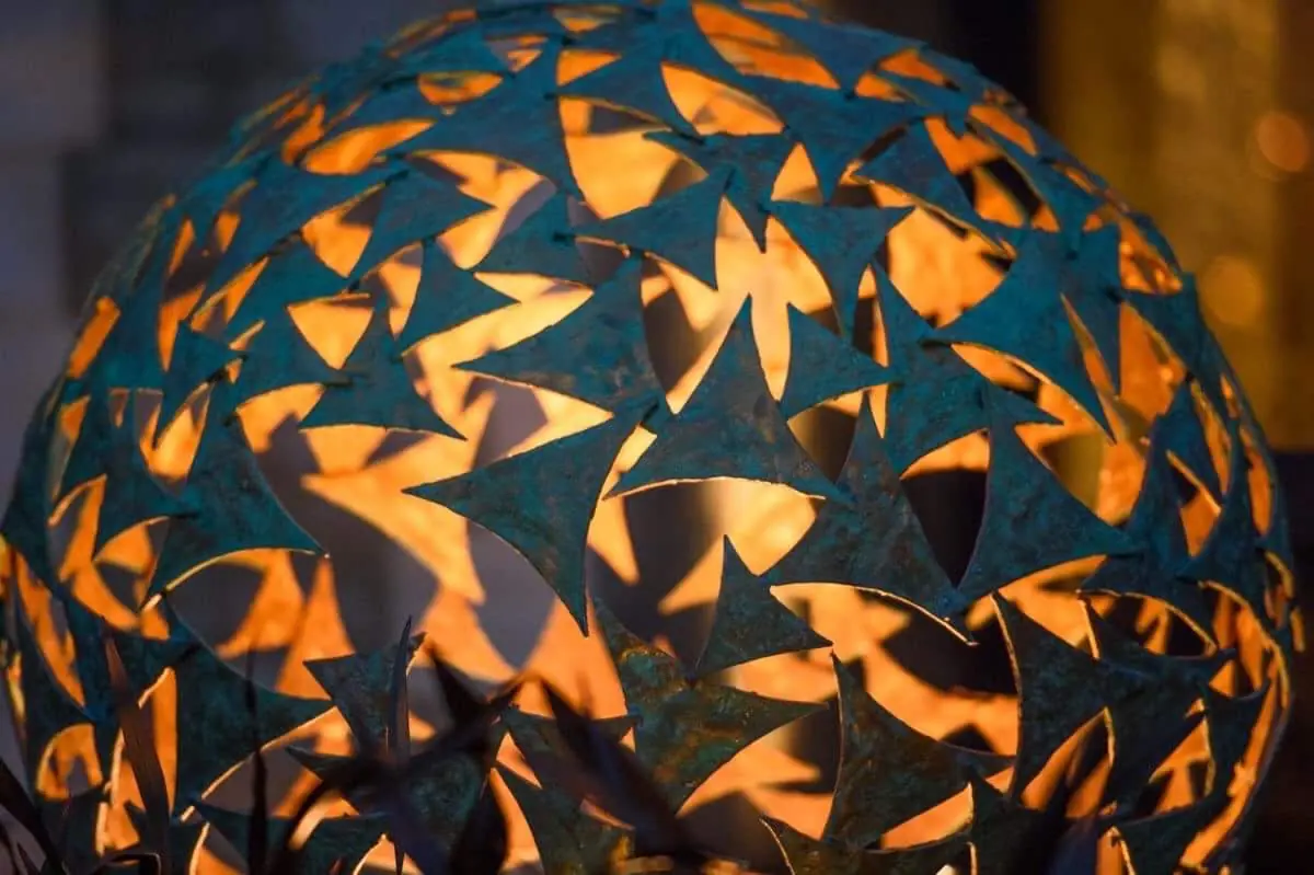 Verdigris and gold sail sphere garden sculpture in mild steel by Charles Elliott