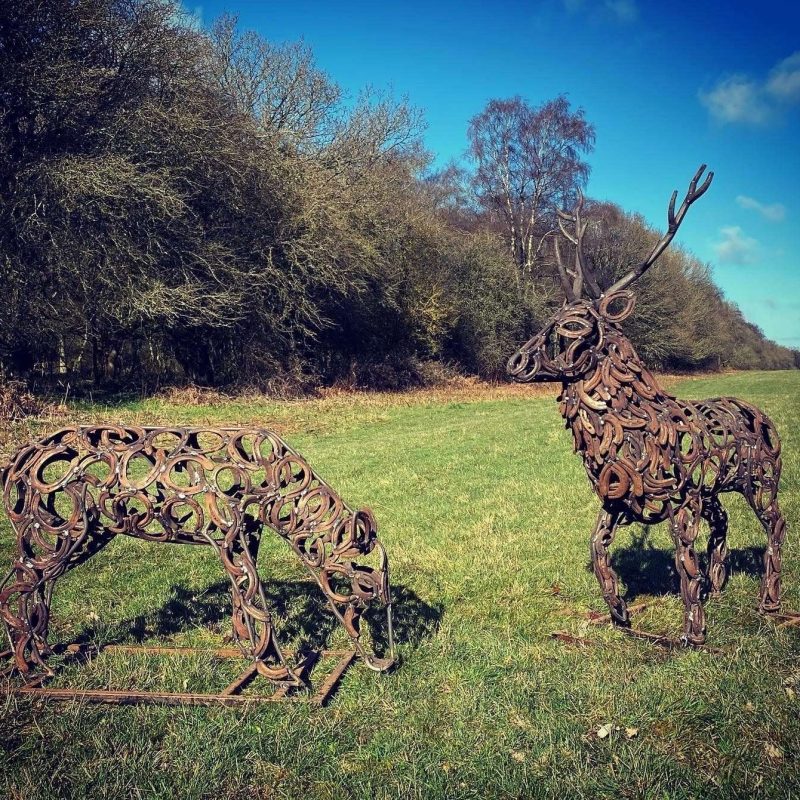Stag and Doe Sculptures Grazing