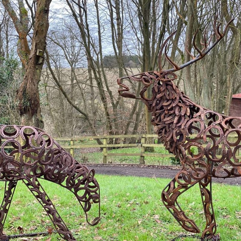 Stag and Doe Sculptures Together