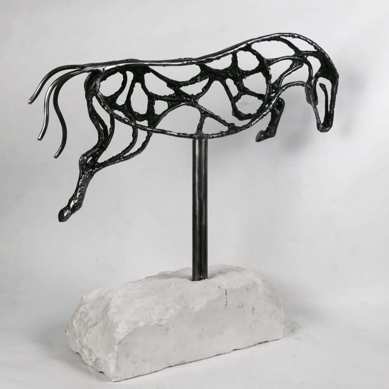 Abstract Jumping Horse Sculpture Against White Background