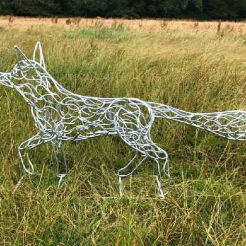 Side View Of Silver Fox Sculpture