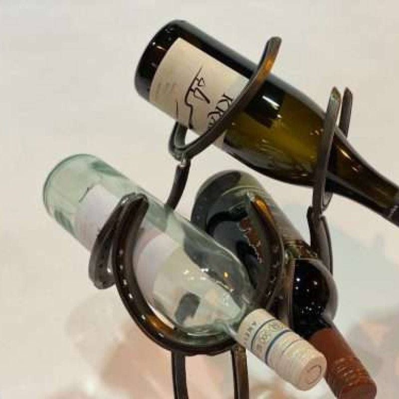 Close Up Of Black Horseshoe Wine Rack