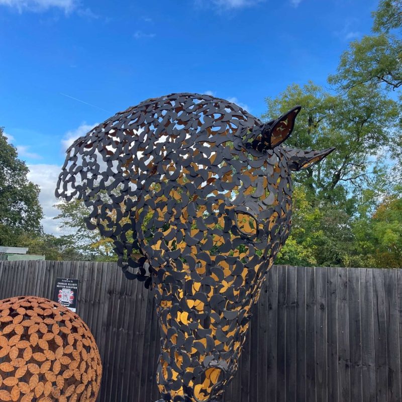 black and gold horse head sculpture looking right