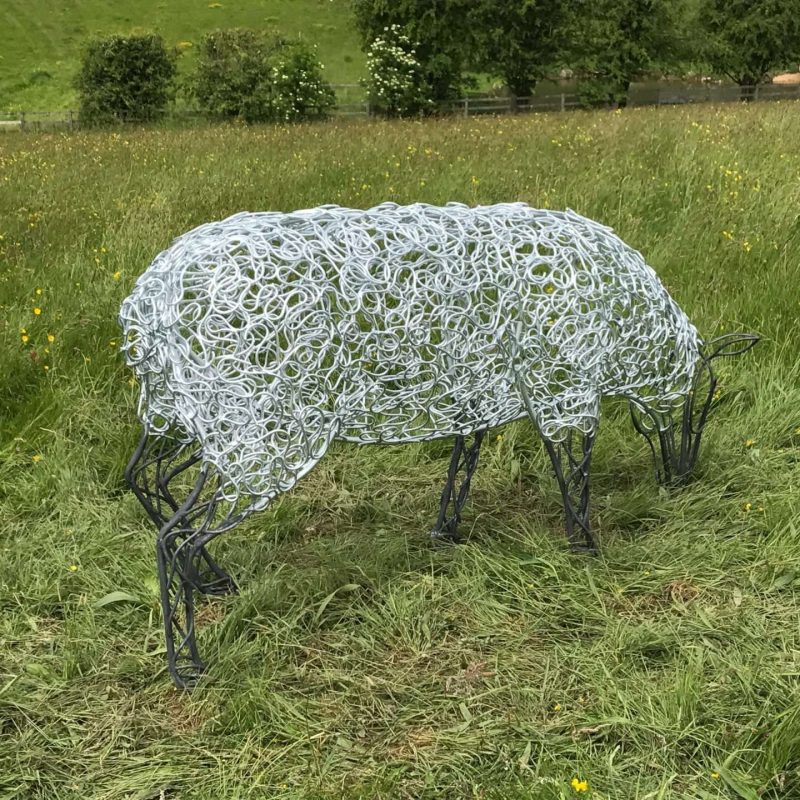 Sheep Sculpture Grazing In A Field