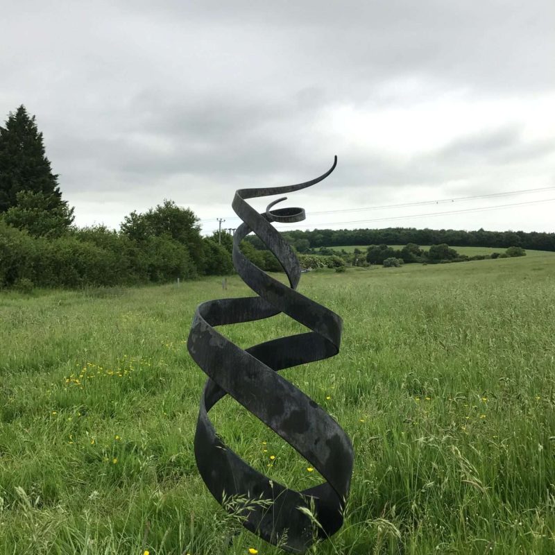 Spiral Abstract Sculpture In A Field