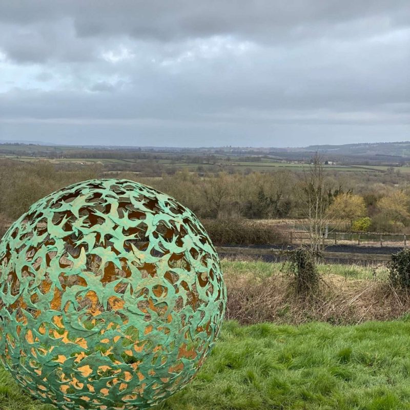 Swift Sphere Sculpture in a field