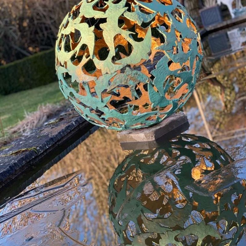 Swift Sphere Sculpture in pond