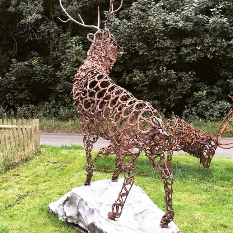 Back Of Stag Sculpture Standing On Rock