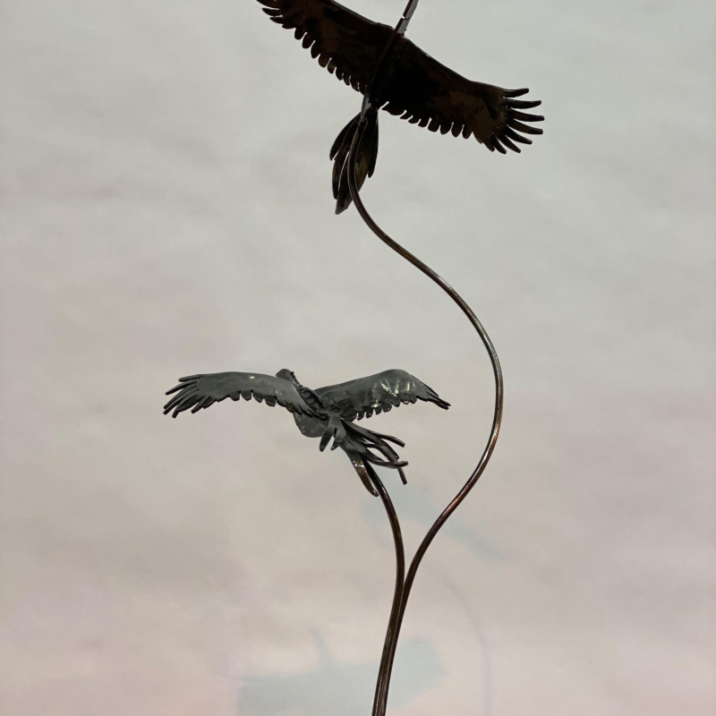 Two Birds Sculpture On Table