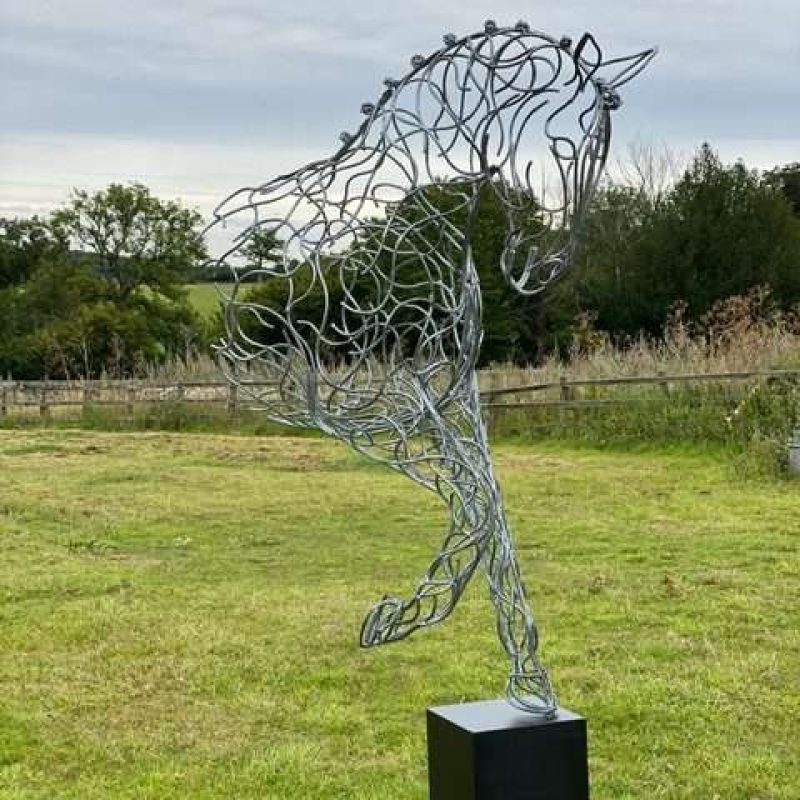 half horse design on black plinth