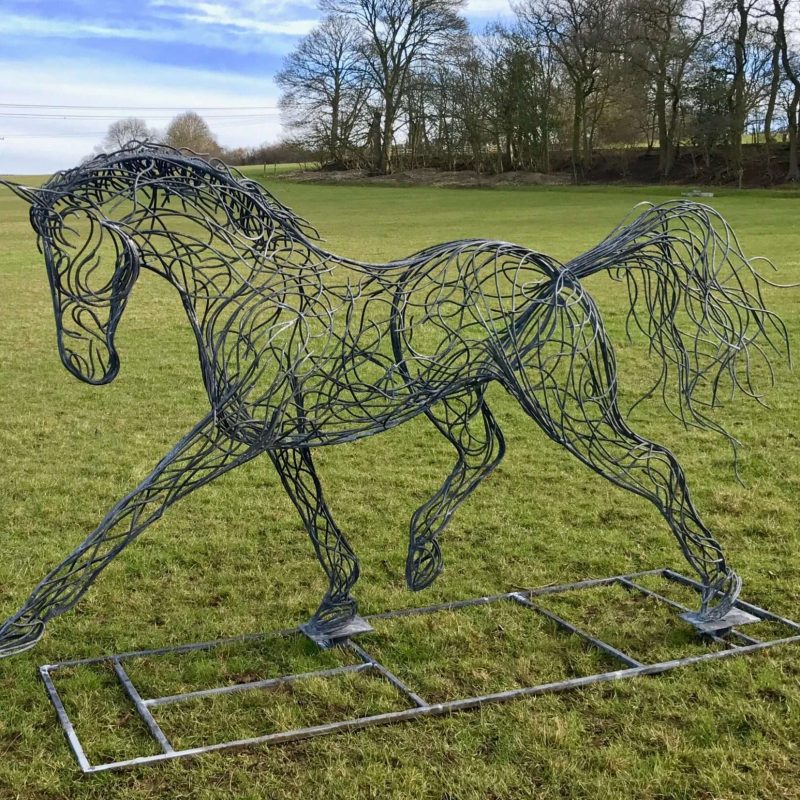 Side Of Black Horse Trotting Sculpture