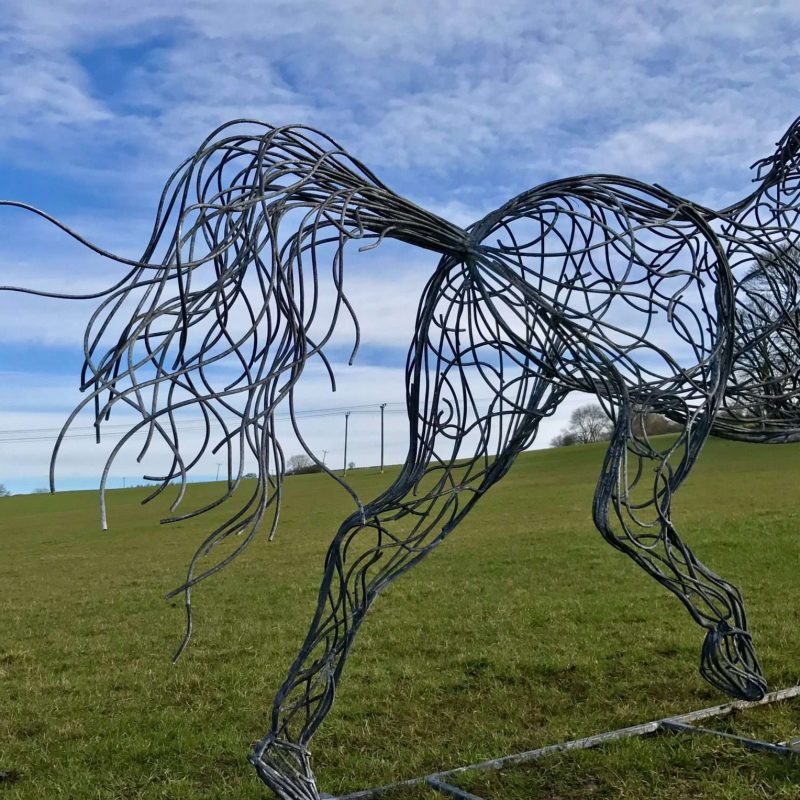 Tail Of Black Horse Trotting Sculpture