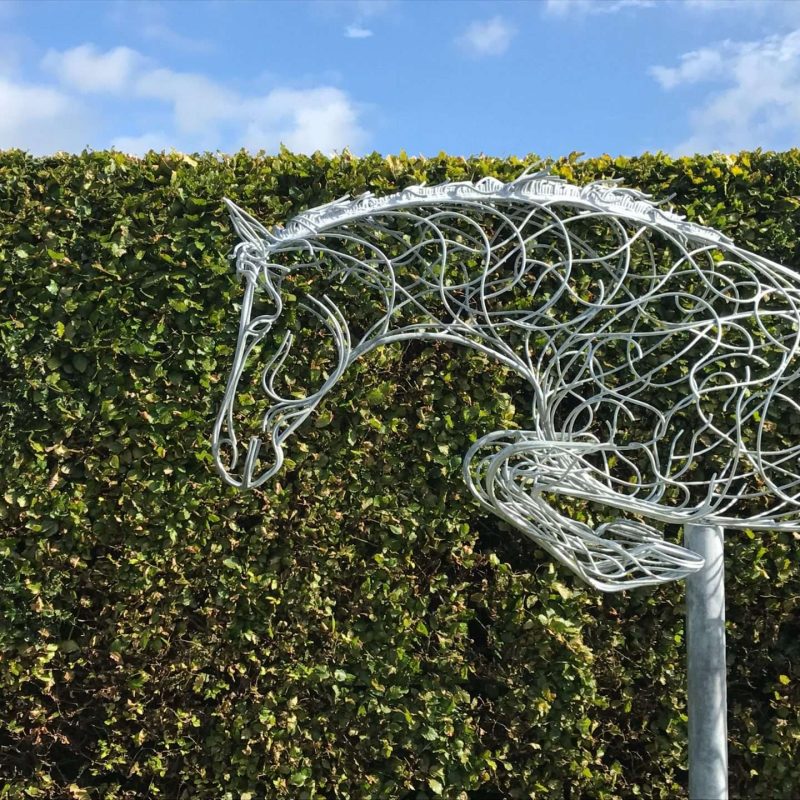 Jumping Horse Next To Hedge