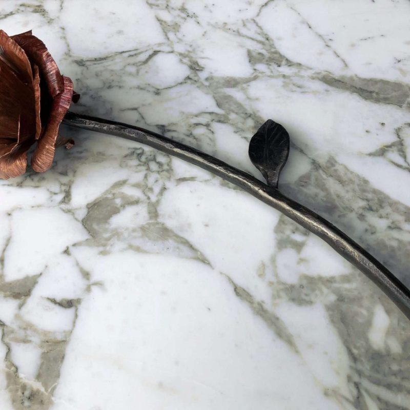 Metal Rose Flower on Marble Table