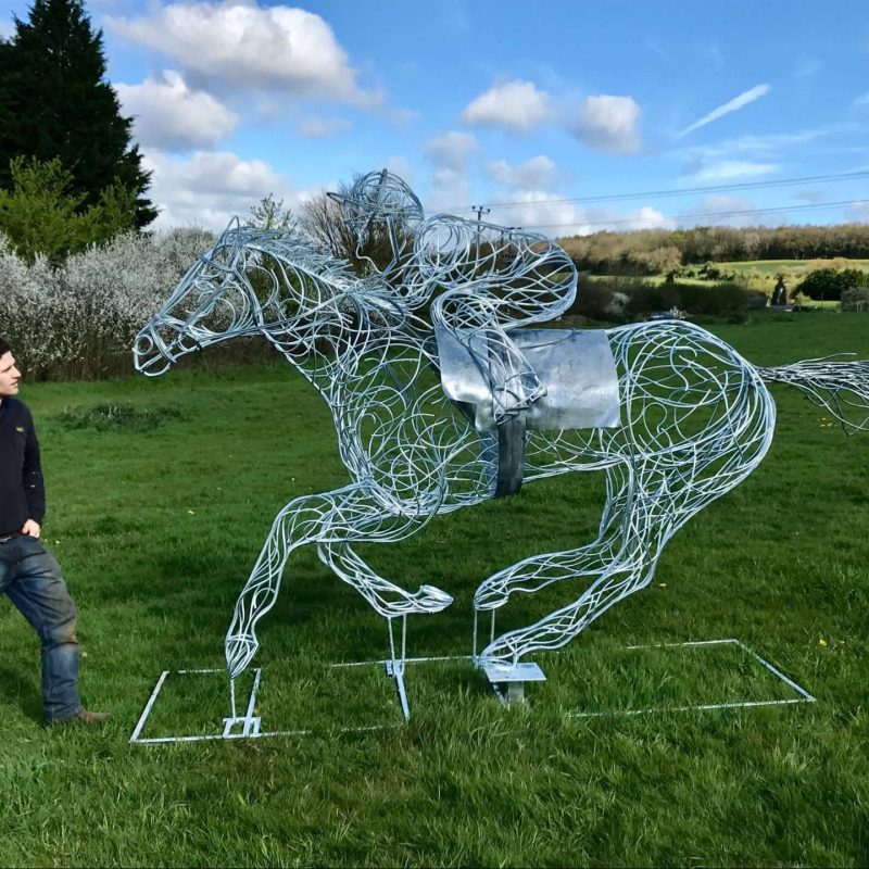 Man Looking At Horse and Jokey Sculpture