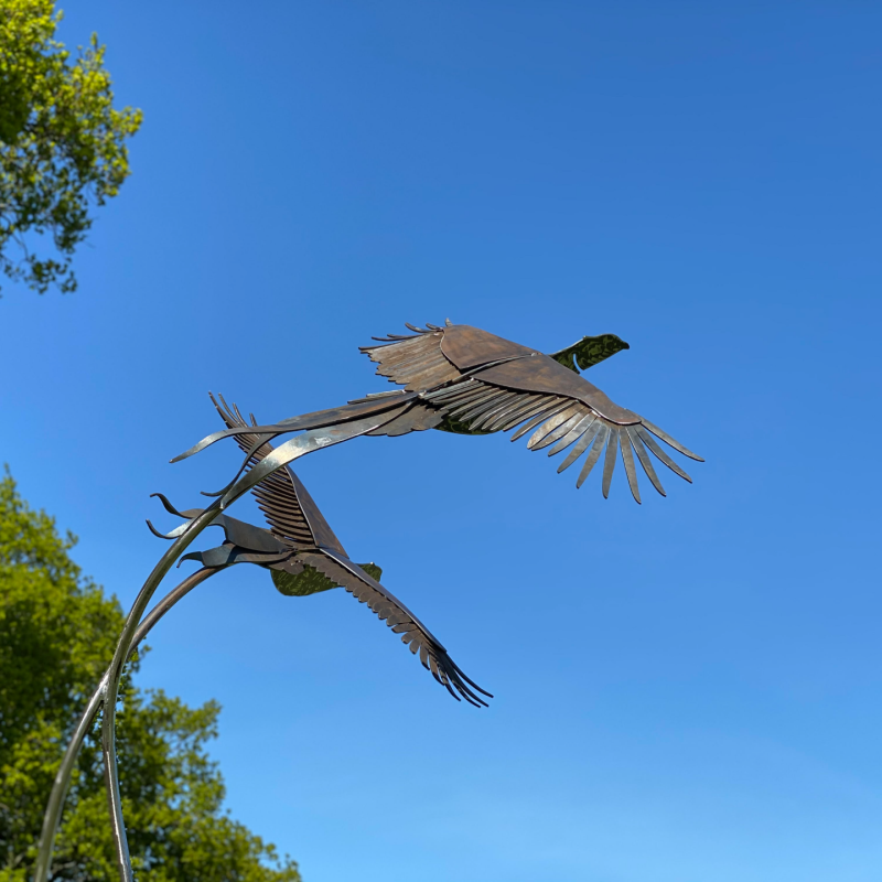 rustic birds flying sculpture